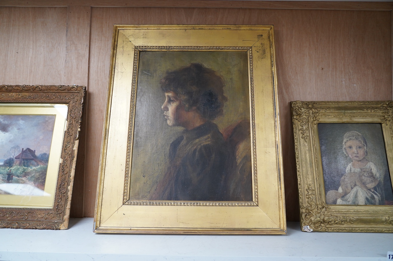 20th century School, oil on board, Profile of a child, stamped ESK lower left, 47 x 35cm, gilt frame. Condition - fair